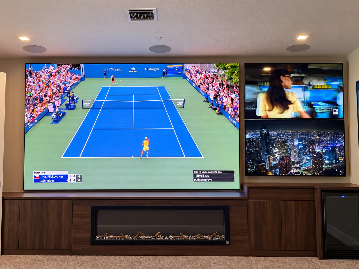 Sentry Savant installation in Palm Beach with a 155-inch video wall and two adjacent televisions